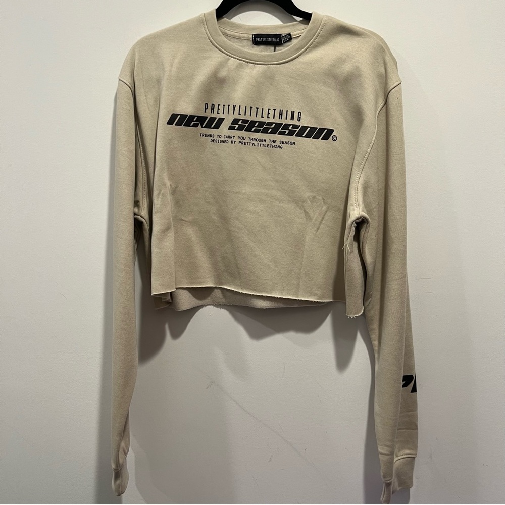 PrettyLittleThing Beige Cropped Sweatshirt with Black Logo
